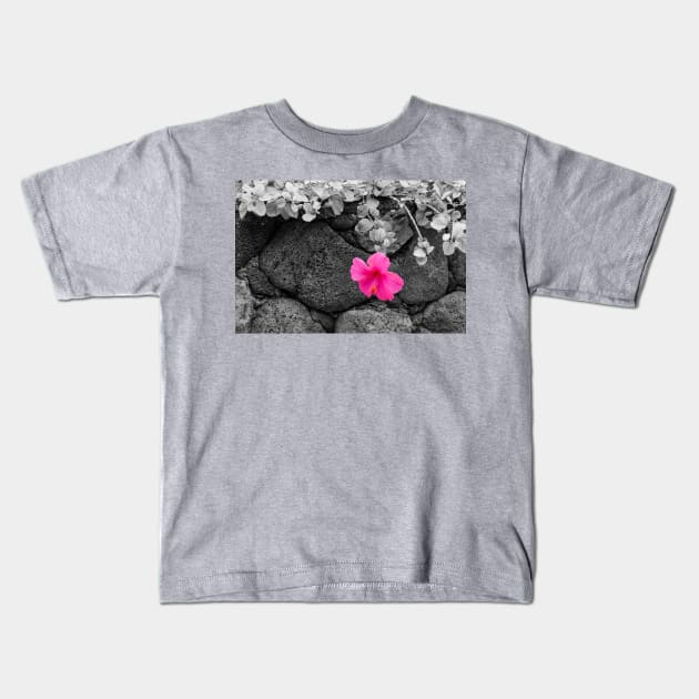 Pink Hibiscus on Lava Rock Wall Kids T-Shirt by DebraCasey